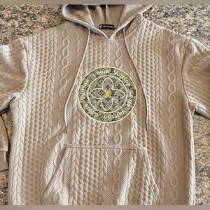 cable knit hoodie with luxury inspired embroidered design